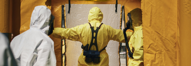 Provider dressed in PPE entering isolation clinic 