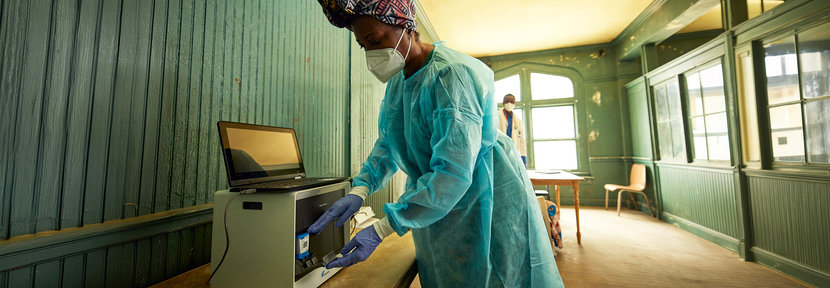 Health worker running a test