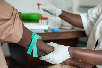  Provider draws blood from patient for sample testing