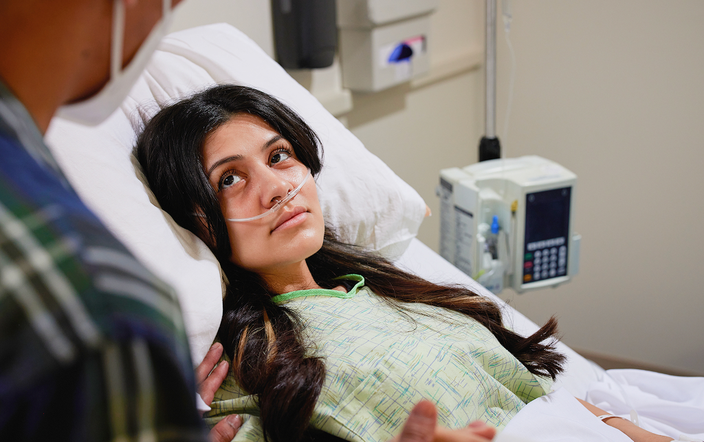 an ill woman listens to a physician
