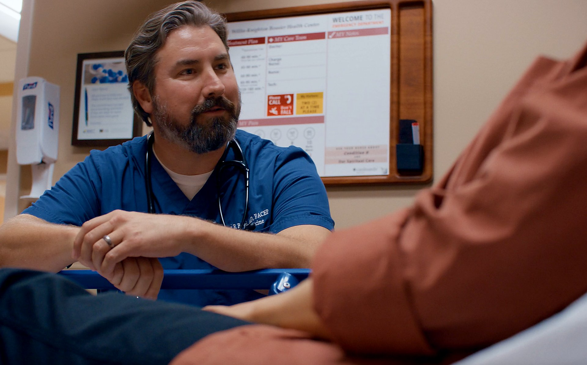 A doctor attending a patient